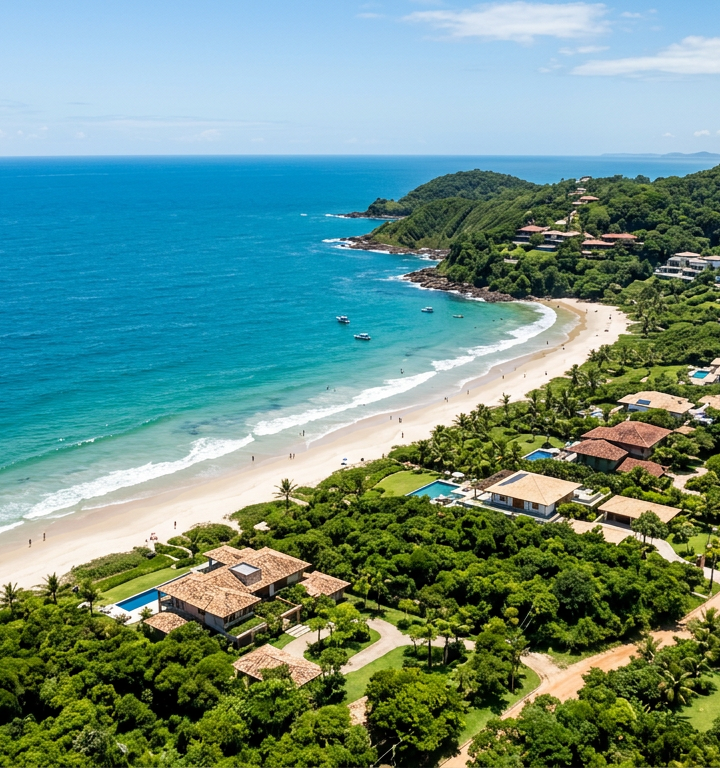 Vista aérea do litoral norte de Ilhéus com condomínios e natureza preservada.